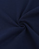 A close-up view of dark navy cotton/poly pique fabric, showcasing its texture and weave.