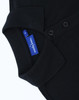 A black ladies' classic cotton/poly pique short-sleeve polo featuring a collar and buttons, with a label visible.