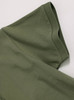 A green ladies ultrafine cotton pique polo, featuring a folded sleeve with a smooth texture and branding detail.
