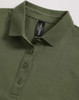 A green ladies polo shirt with a collared neck and a button placket, featuring a logo tag inside.