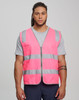 A pink hi-vis safety zip vest with reflective stripes and utility pockets, worn by a model.