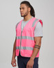 A bright pink safety vest with reflective stripes, featuring utility pockets and a front zip, worn by a male model.
