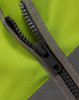 A close-up of a zip on a high visibility safety vest in bright yellow and grey. The vest features utility pockets.