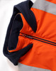 A unisex hi-vis hooded puffer vest in orange with contrasting navy detailing and reflective strips.