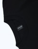 A black unisex heavy cotton oversized tee featuring a tag with branding on the inner neckline.