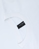 A white unisex heavy cotton oversized tee featuring a rounded neckline and a tag on the inside.