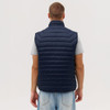 A navy puffer vest with a high collar and quilted design, displayed from the back.