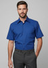 A blue short sleeve button-up shirt for men, featuring a collar and a logo on the chest pocket.