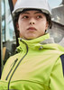 A women's bright yellow stretch softshell jacket with a hood, worn by a person in a hard hat.