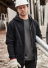 A black unisex zip front multi-pocket hoodie displayed on a person wearing gloves and a hard hat in a work environment.