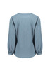 A women's long sleeve blouse in light blue, featuring a ruché design and a relaxed fit. It has a logo on the back.
