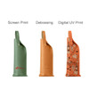 Three elegant PU leather wine bags in green, tan, and orange with decorative patterns, featuring branding on some.