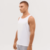 A white singlet displayed on a model, featuring a simple design and sleeveless cut. The model has a neutral expression.