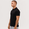 A black polo shirt featuring a collar and short sleeves, shown from the side with a plain design.