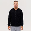 A black zip-up hooded sweatshirt with long sleeves, displayed on a model wearing grey pants.