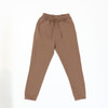 Brown track pants with an elastic waistband and tapered legs, featuring a branding logo.