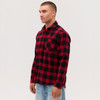 A long sleeve flannel shirt in red and black check pattern, featuring a front pocket and a logo.