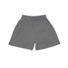 A pair of youth shorts in dark grey with an elastic waistband and a logo.