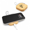 A square wireless charger with a bamboo design and a connected charging cable, with a smartphone on top, showing battery status.