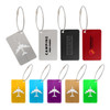 A collection of colourful metal luggage tags in various designs, including silver, black, red, yellow, blue, green, purple, and gold.