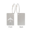 A silver luggage tag with an airplane design on one side and a plain back, featuring a wire cable attachment.