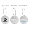 A set of three round wire cable luggage tags in silver, featuring different printing options and a space for names.