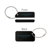 A square brushed aluminium luggage tag in black, featuring a logo, with a wire loop for attachment.