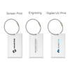 A square aluminium luggage tag in three styles: screen print, engraving, and digital UV print, featuring a silver ring.