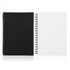 A5 spiral-bound notebook featuring a black cover on one side and a white cover on the other, with spiral binding.