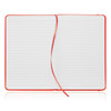A red A5 notebook journal with lined pages and a ribbon marker. It has a smooth leather-like finish.