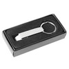 A drink bottle opener in a sleek silver finish, stored in a black box with a soft interior. It features a keyring attachment.