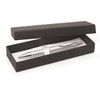 A sleek silver pen nestled in a black gift box. The box is slightly open, revealing the pen inside.