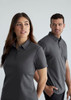 A grey short sleeve polo shirt for men, featuring a collar and a logo. Two models are wearing the polo.
