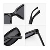 A pair of vintage rectangle sunglasses in glossy black, showcasing details of the frames and arms.