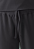Unisex straight leg scrub pants in black, featuring an elastic waistband with a drawstring. includes a logo.