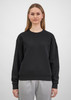 A black women's crew sweatshirt is displayed on a model, featuring a relaxed fit and long sleeves.