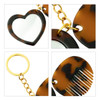 A tortoiseshell heart-shaped mirror and comb keyring with gold accents and a circular keyring attachment.