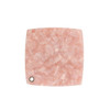 A square acetate vanity mirror in a soft pink, featuring a textured, marbled finish and a small hole for hanging.