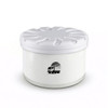 A round white air freshener container with a lid, featuring a simple logo. The base has a clear, light design.