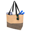 A large zipped tote in natural and black tones, featuring sunglasses and items like towels and utensils inside.