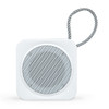 A white portable speaker with a round mesh grille and a fabric strap. The design is minimalist and compact.