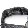 A custom elastic headband featuring a patterned design in shades of black and grey, with a small logo.