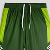 Green active pants with bright green accents, featuring a white drawstring and a logo. Ideal for sports or workouts.