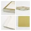 A custom picture frame-style gift box in white with a decorative gold pattern and a gold interior. It has a logo.