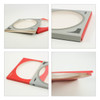 A custom CD-style gift box in red and grey with a clear circular window on the front.
