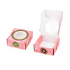 A small pink custom gift box with a round window and a donut pattern, featuring an open lid and a closed base.