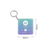 A square acrylic keychain featuring a gradient design in blue and purple, with a logo and playback controls.