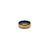A ceramic ring featuring a black band with a textured gold design. It has a shiny finish and includes a logo.