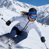 A skier wearing a blue and patterned headband and ski gear, navigating through snowy mountains.