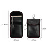 A black carbon fibre Faraday key pouch with red stitching, featuring a keyring and a clip.
